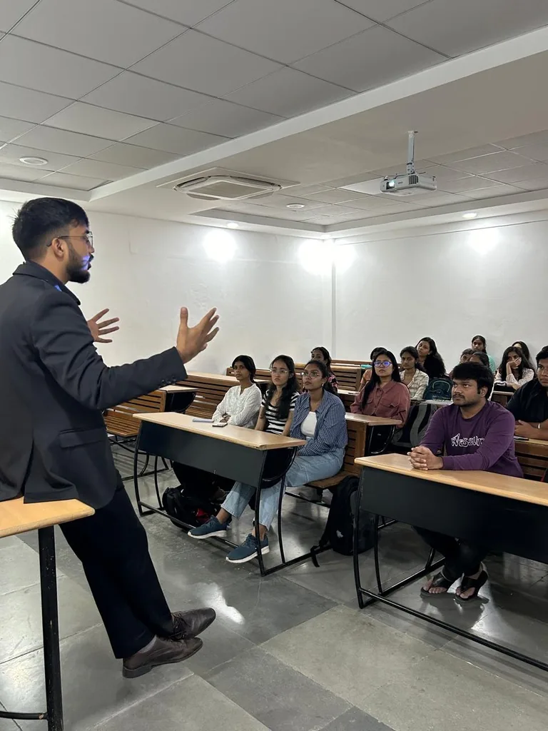 Siram speaking with engineering students in a classroom