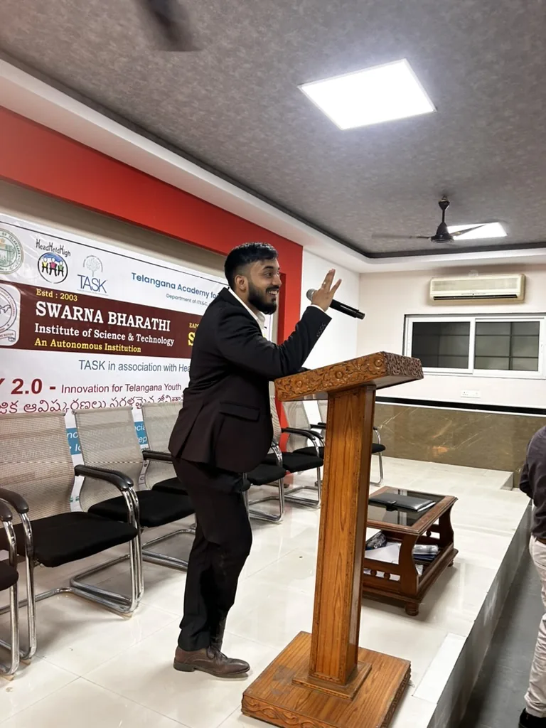 Siram speaking at a podium